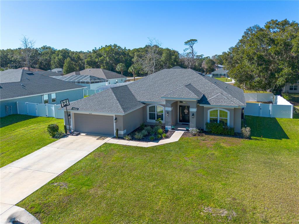 10170 Southwest 78th Court Ocala, FL 34476 - Photo 2 of 44 a view of house with garden and patio