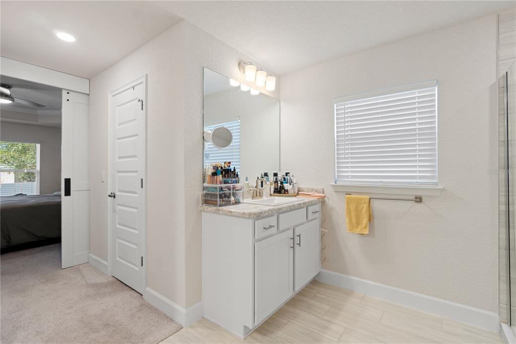 10170 Southwest 78th Court Ocala, FL 34476 - Photo 25 of 44 a bathroom with a sink a vanity and a mirror