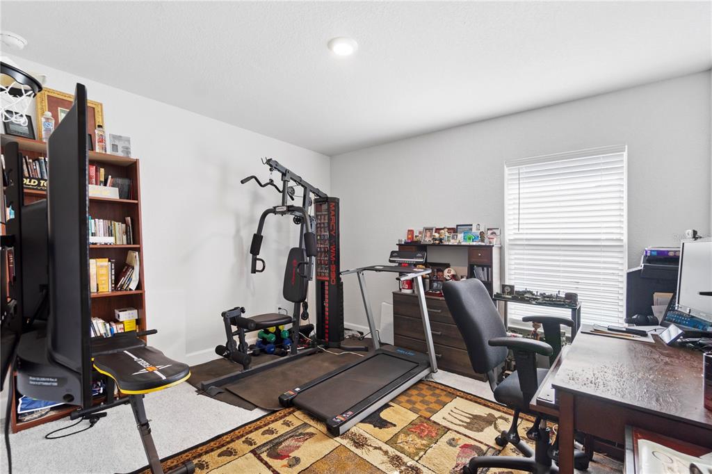 10170 Southwest 78th Court Ocala, FL 34476 - Photo 32 of 44 a view of a room with gym equipment