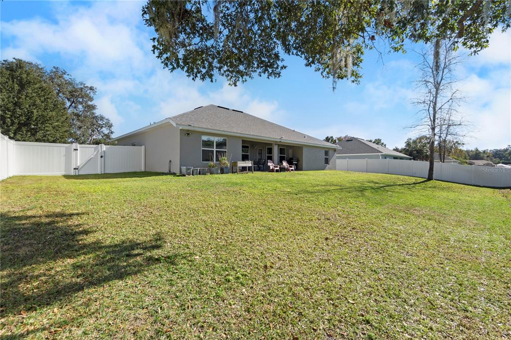 10170 Southwest 78th Court Ocala, FL 34476 - Photo 9 of 44 a view of a house with a yard