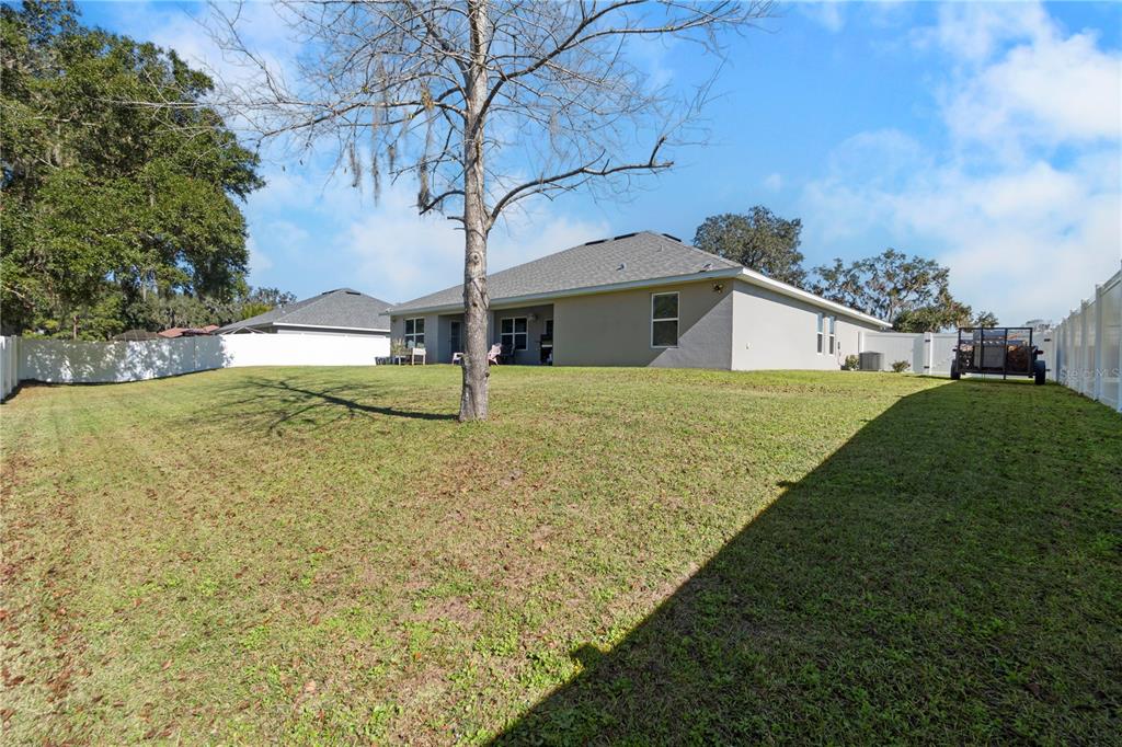 10170 Southwest 78th Court Ocala, FL 34476 - Photo 9 of 43 a view of a house with a yard
