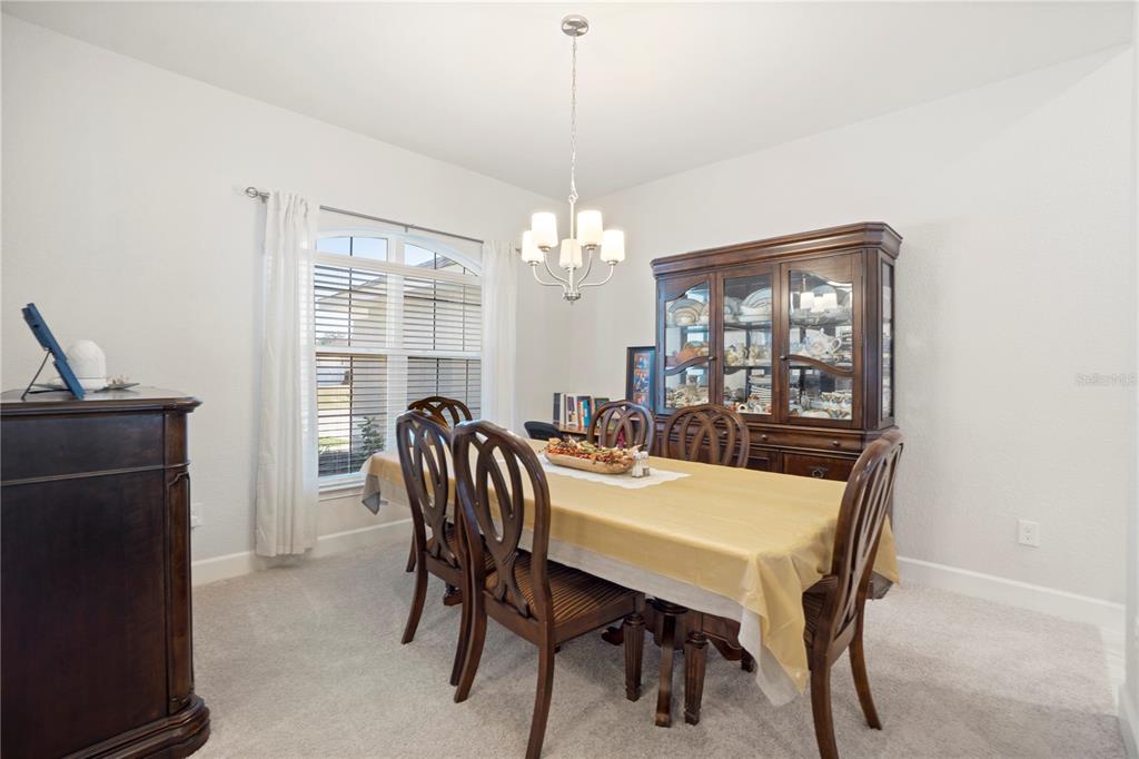 10170 Southwest 78th Court Ocala, FL 34476 - Photo 10 of 43 a view of a dining room with furniture and window
