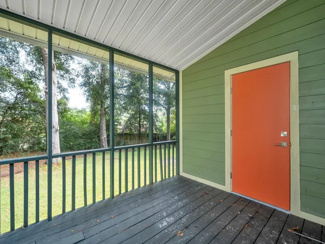 a view of balcony with wooden floor