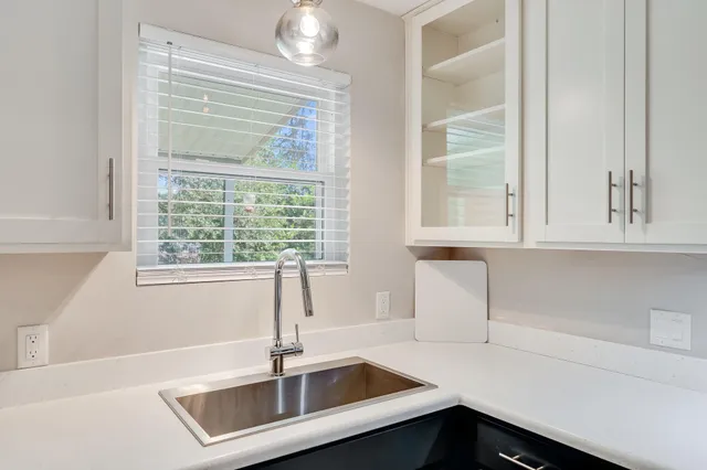 a kitchen with a sink and a window