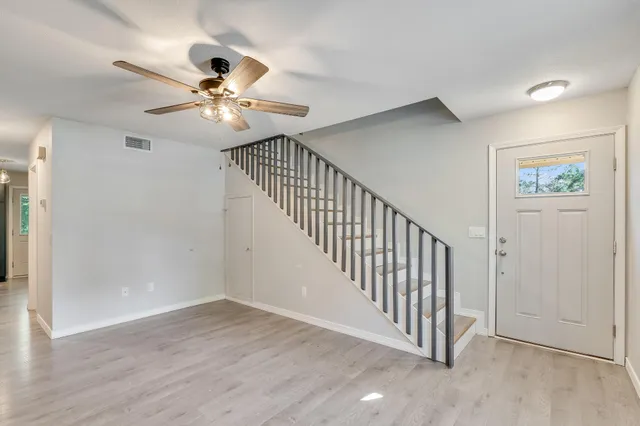 a view of entryway with wooden floor