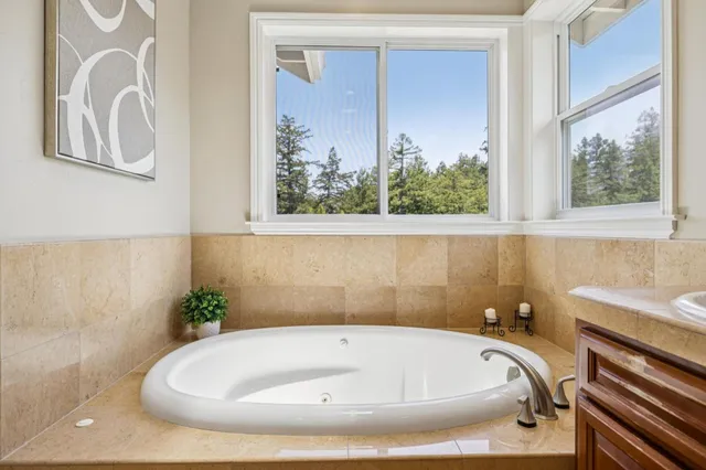a front view of a house with a yard and balcony