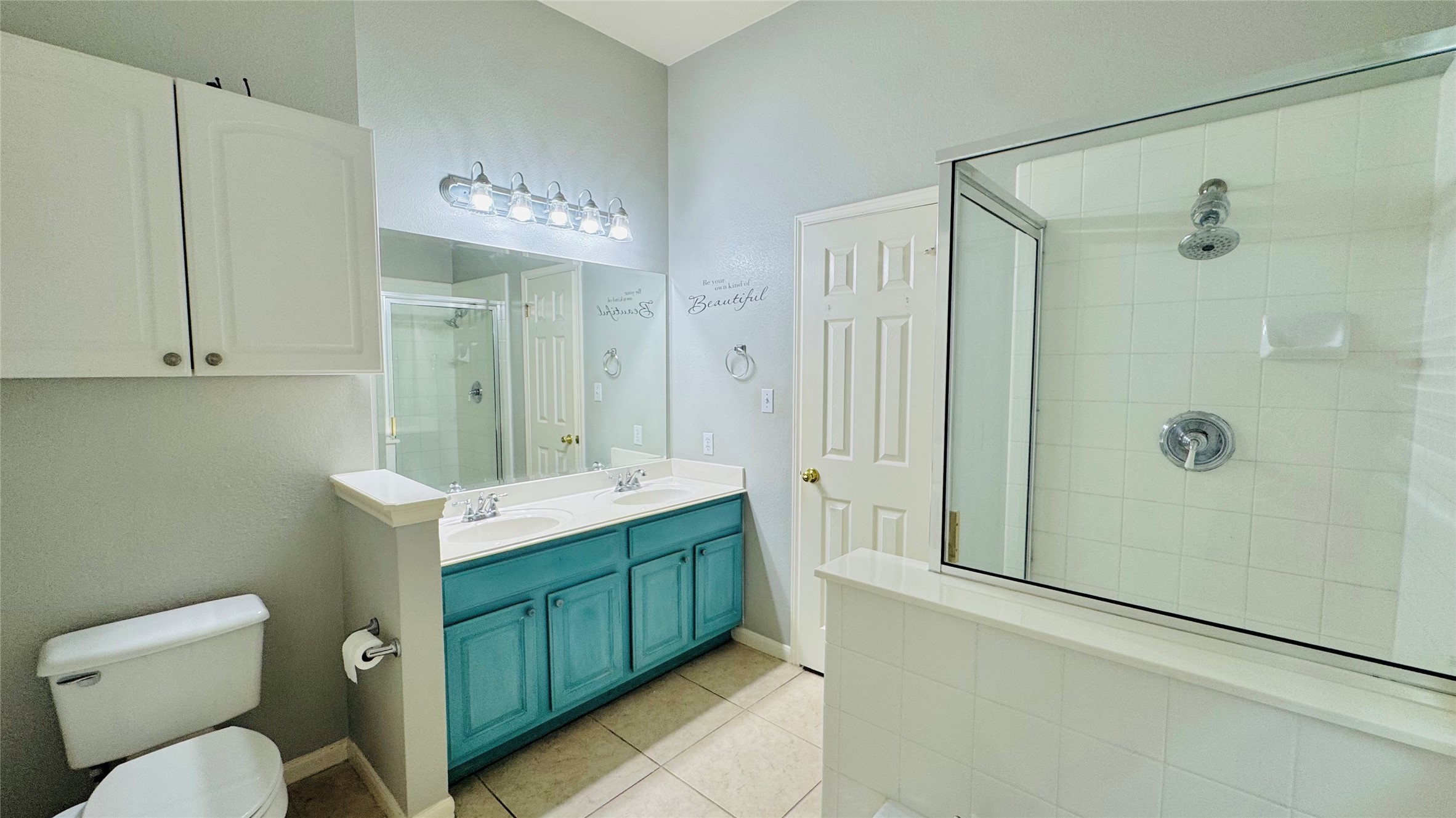 401 Witte Road Kyle, TX 78640 - Photo 11 of 24 Master bathroom- A vibrant double vanity complements the shower in this well-appointed bathroom.