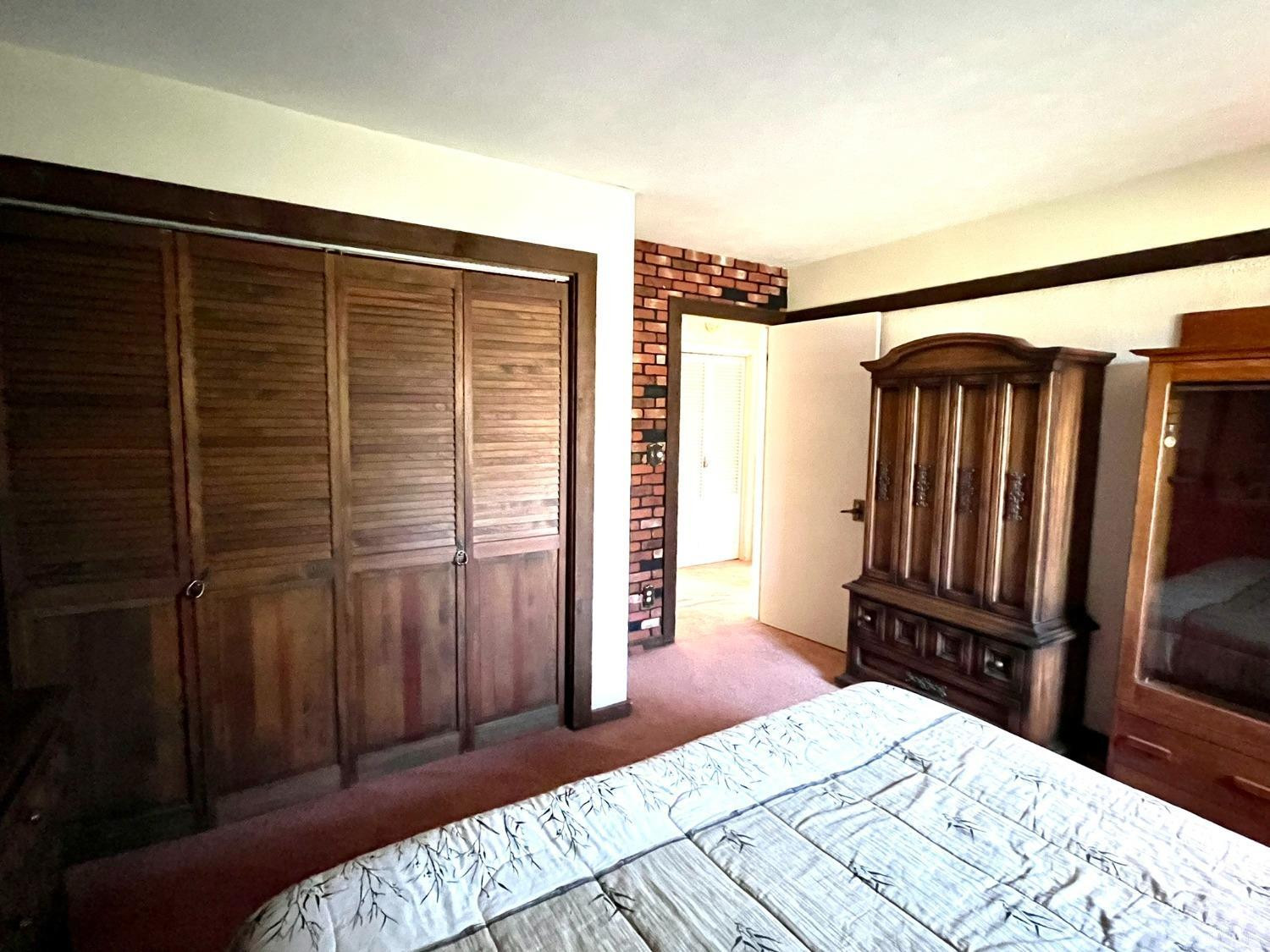 375 Church Road Hudson, NY 12534 - Photo 13 of 15 a bedroom with a bed dresser and a flat tv screen