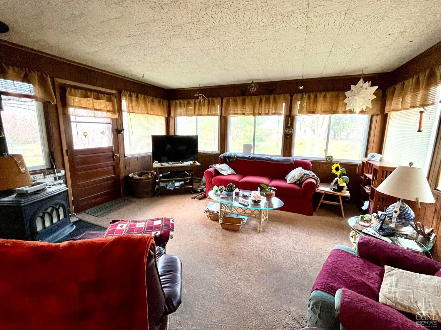 375 Church Road Hudson, NY 12534 - Photo 5 of 15 a living room with furniture and a flat screen tv
