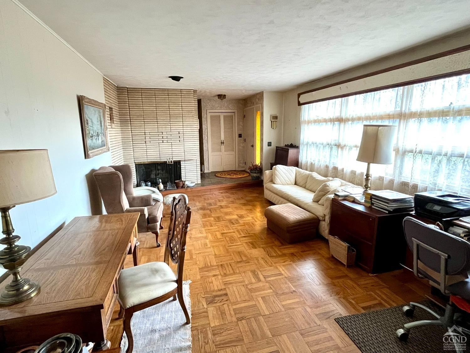 375 Church Road Hudson, NY 12534 - Photo 7 of 15 a living room with fireplace furniture and a large window