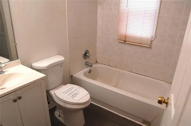 a bathroom with a sink a toilet a bathtub and a shower