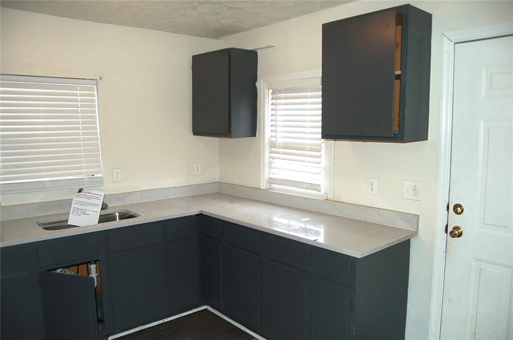 856 Beckwith Street Southwest Atlanta, GA 30314 - Photo 16 of 19 a bathroom with a sink and a mirror