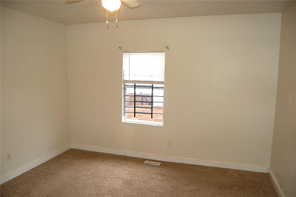 856 Beckwith Street Southwest Atlanta, GA 30314 - Photo 18 of 19 an empty room with a window