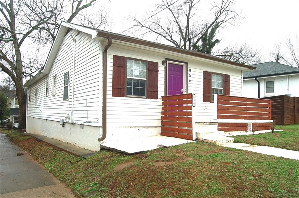 856 Beckwith Street Southwest Atlanta, GA 30314 - Photo 4 of 19 a front view of a house with a yard