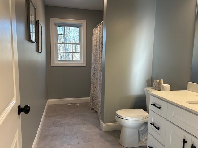 611 Prospect Street Methuen, MA 01844 - Photo 21 of 25 a bathroom with a toilet a sink and tub