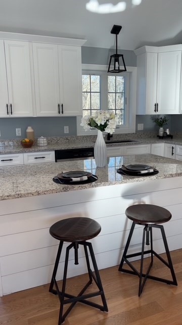 611 Prospect Street Methuen, MA 01844 - Photo 9 of 25 a kitchen with a table chairs stove and cabinets