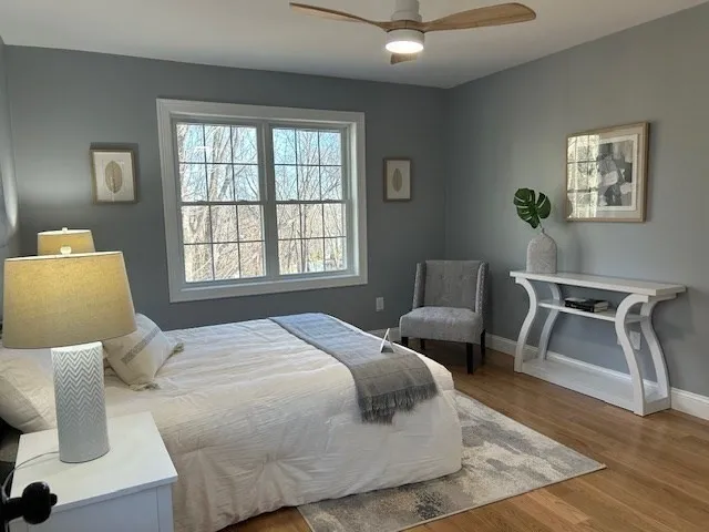 a bedroom with a bed and window