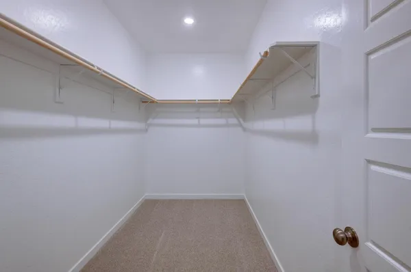 a bathroom with double vanity sink and a mirror