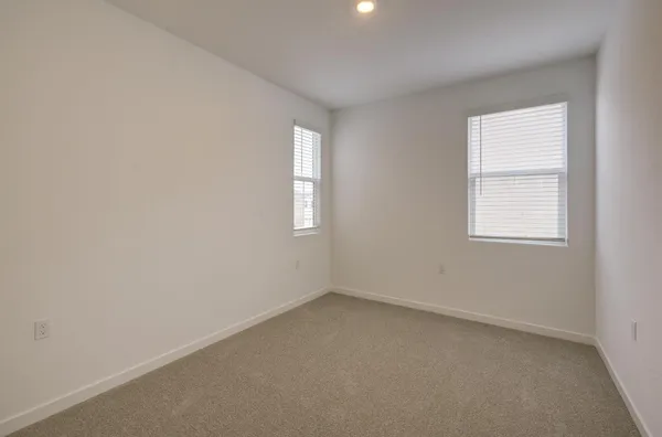 an empty room with closet area
