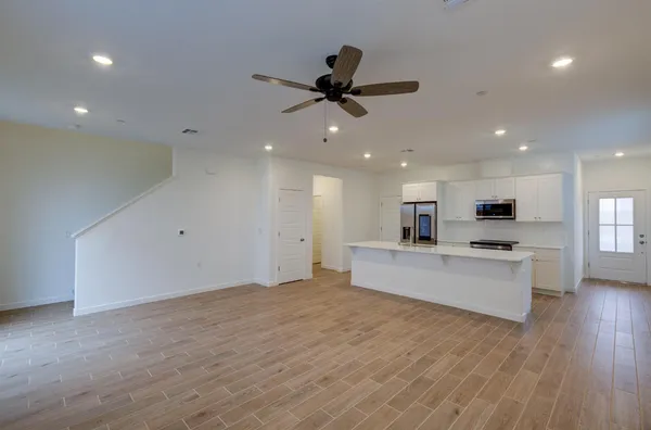 a view of a kitchen with a sink and a microwave