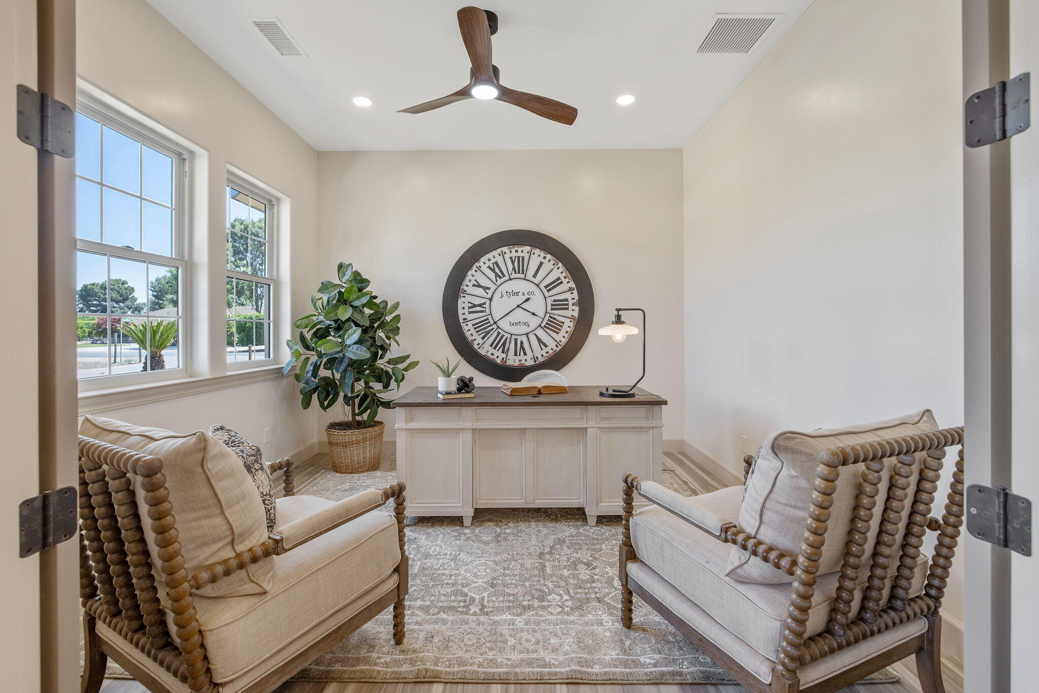 503 East Palm Street Exeter, CA 93221 - Photo 11 of 92 a living room with furniture a clock and a large window