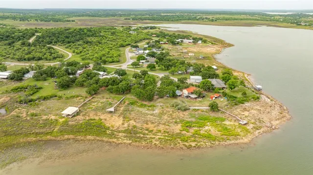 a view of a lake with a big yard