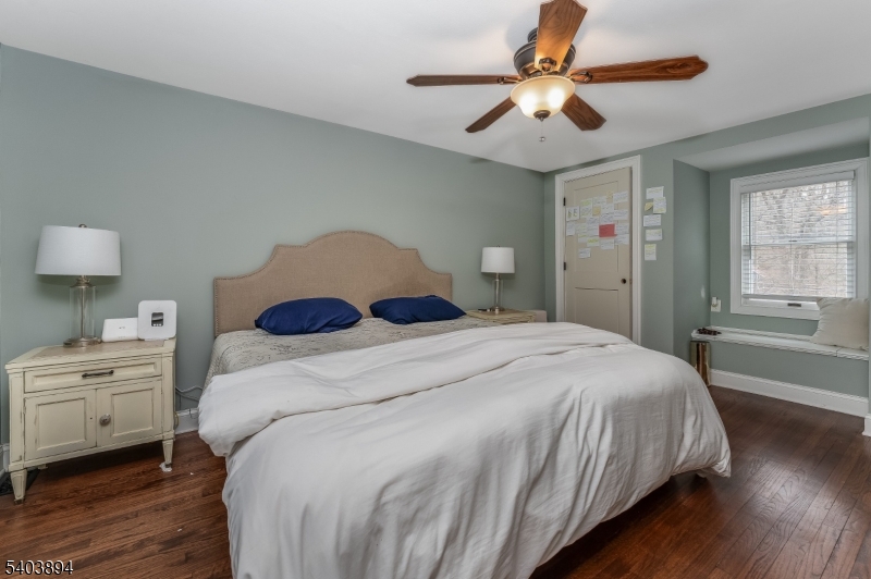 18 Sanatorium Road Glen Gardner, NJ 08826 - Photo 13 of 31 a bedroom with a large bed and a chandelier