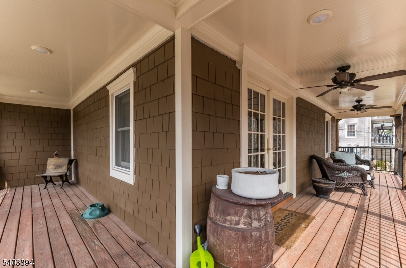 18 Sanatorium Road Glen Gardner, NJ 08826 - Photo 18 of 31 a view of a patio with couches table and chairs and wooden floor