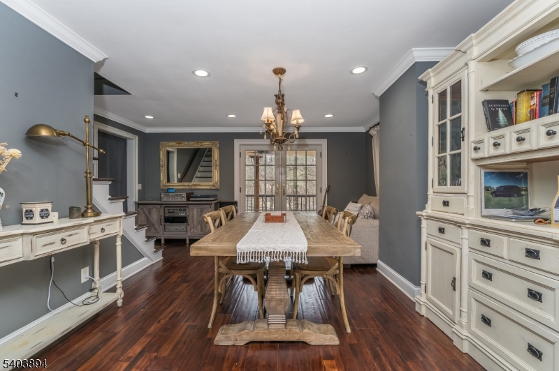 18 Sanatorium Road Glen Gardner, NJ 08826 - Photo 22 of 31 a dining room with wooden floor a chandelier a wooden table and chairs