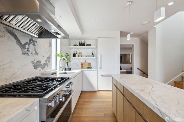 a kitchen with a stove and a sink