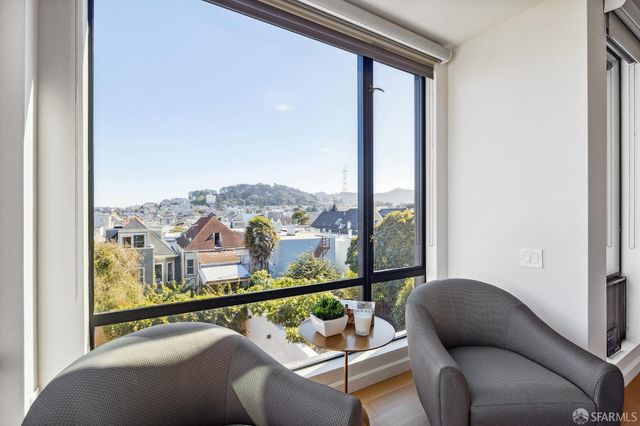 a view of a balcony with furniture