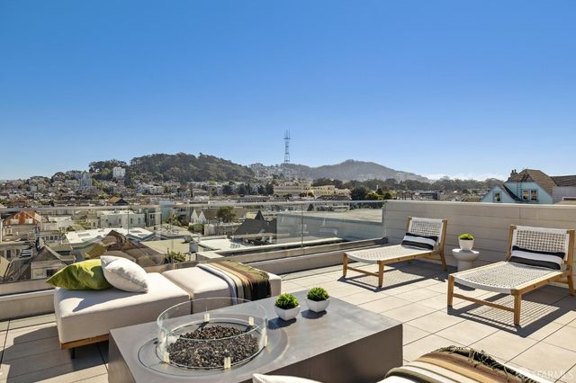 a view of a terrace with furniture