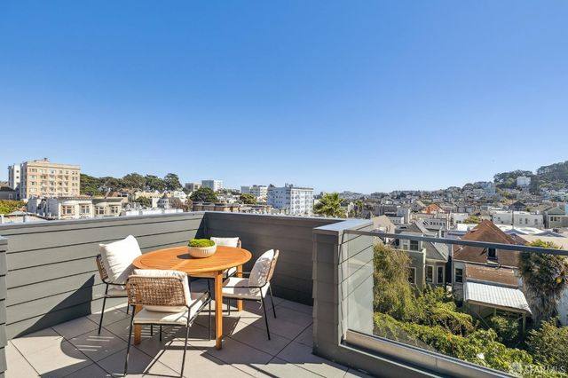a view of a chairs and table on the terrace