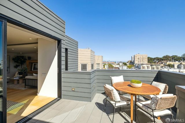 a view of a chairs and table in the terrace