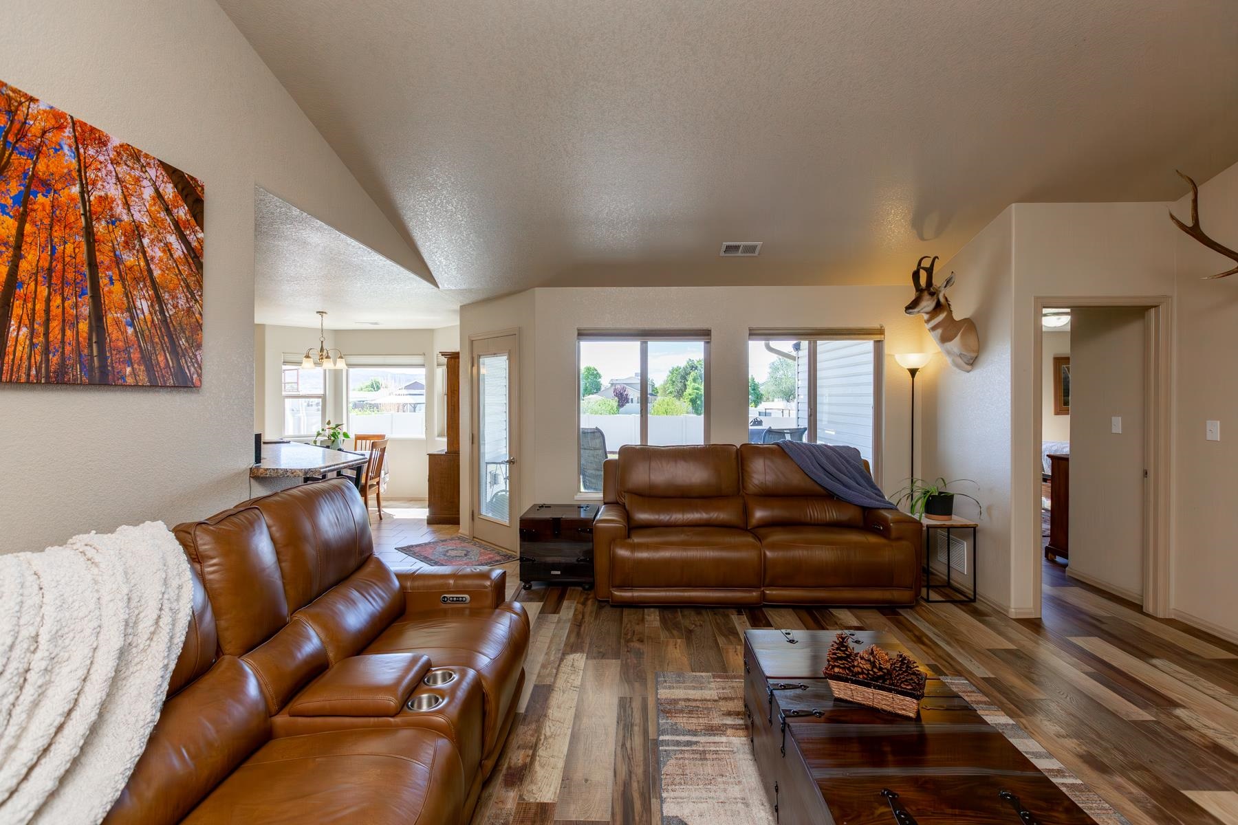 103 Red Rocks Street Fruita, CO 81521 - Photo 19 of 39 a living room with furniture fireplace and a rug