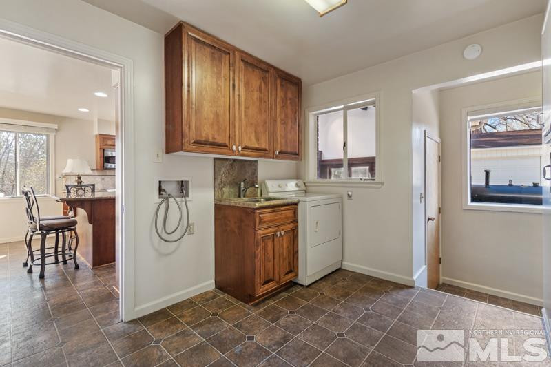 2250 Foothill Road Reno, NV 89511 - Photo 12 of 37 a kitchen with a refrigerator and cabinets
