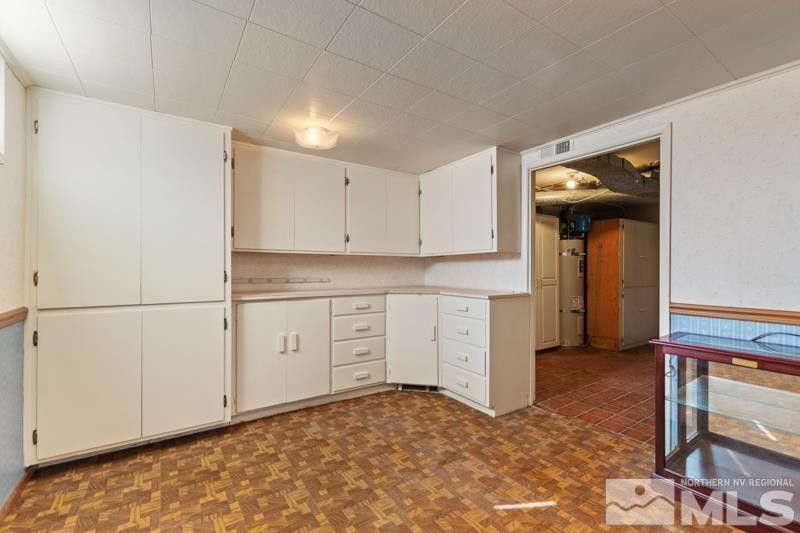 2250 Foothill Road Reno, NV 89511 - Photo 23 of 37 a kitchen with white cabinets and white appliances