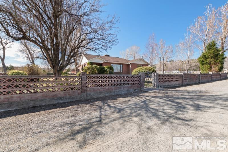 2250 Foothill Road Reno, NV 89511 - Photo 3 of 37 a view of a yard with a snow on the road