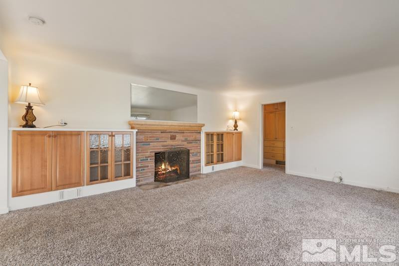 2250 Foothill Road Reno, NV 89511 - Photo 5 of 37 a view of an empty room with a fireplace