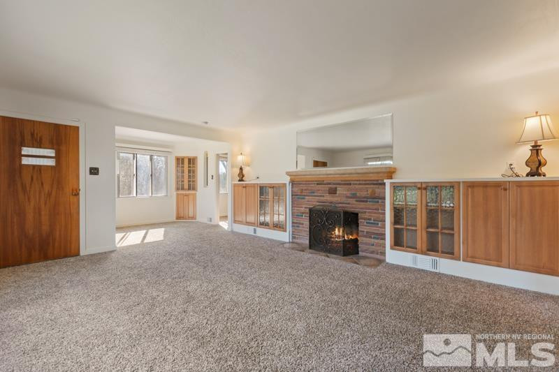 2250 Foothill Road Reno, NV 89511 - Photo 6 of 37 a view of a livingroom with an empty space and a fireplace