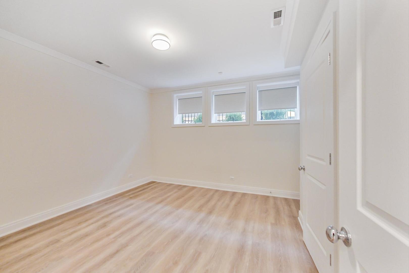 4311 North Western Avenue, Unit 1 Chicago, IL 60618 - Photo 15 of 18 wooden floor in an empty room