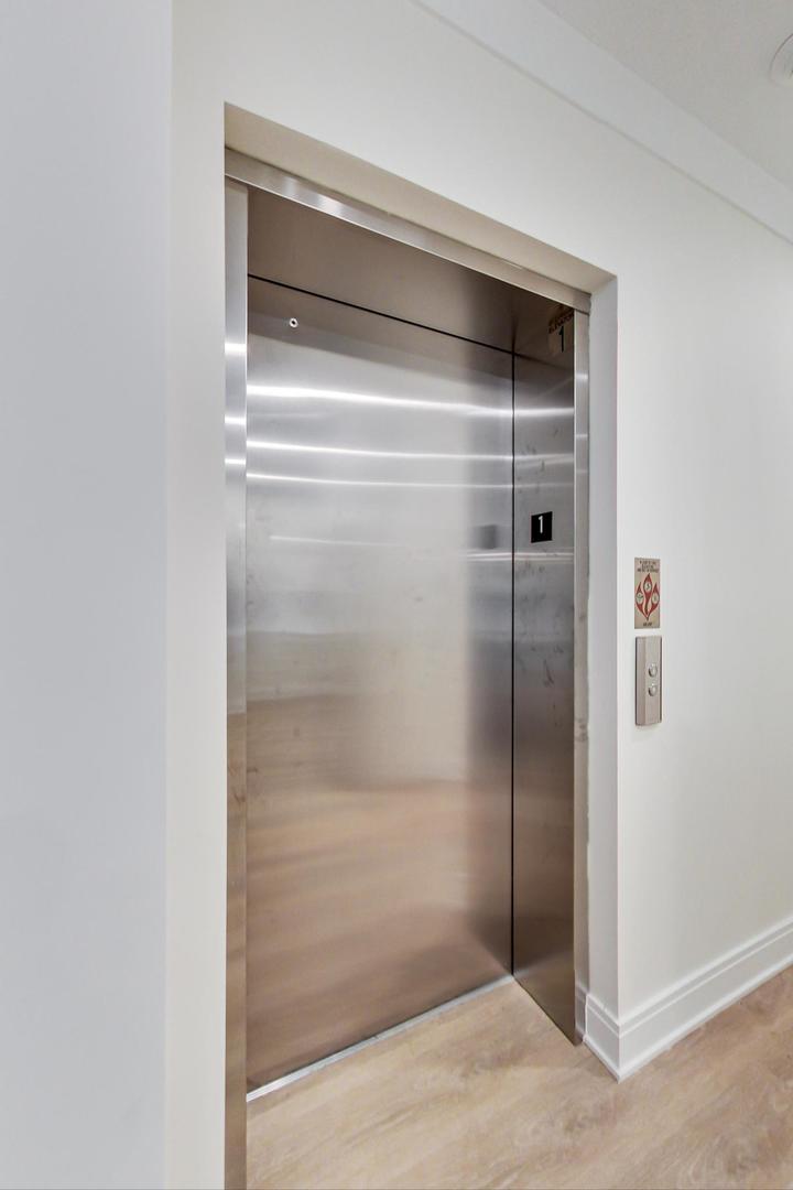 4311 North Western Avenue, Unit 1 Chicago, IL 60618 - Photo 18 of 18 a bathroom with a glass shower door