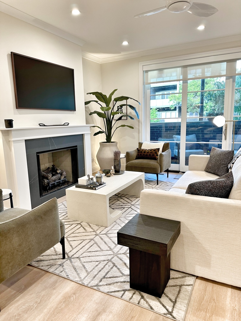 4311 North Western Avenue, Unit 1 Chicago, IL 60618 - Photo 7 of 18 a living room with fireplace furniture and a flat screen tv