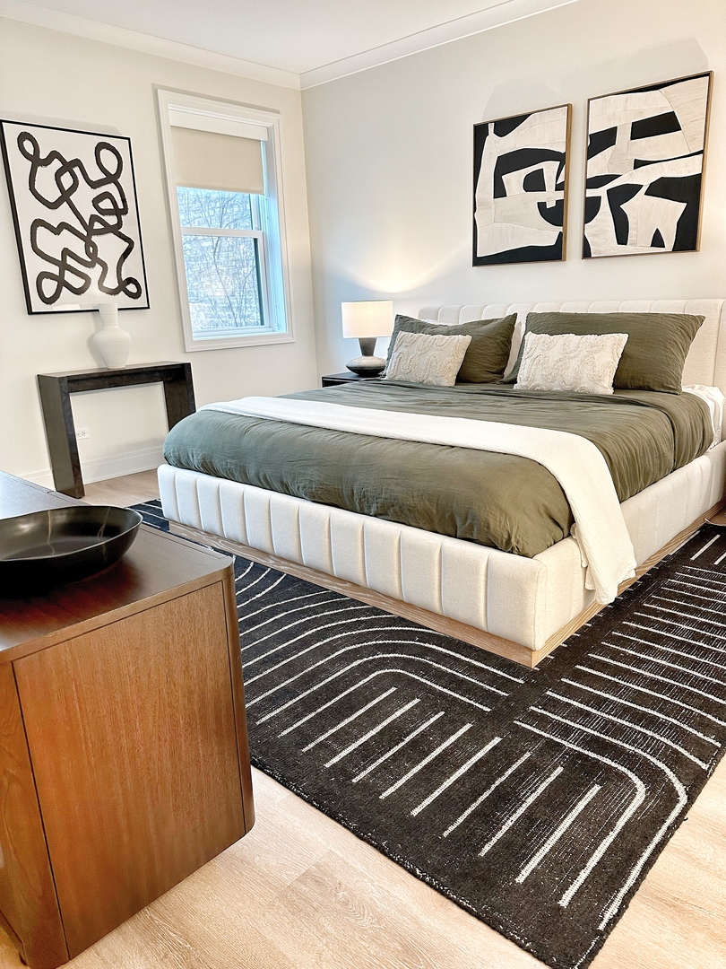 4311 North Western Avenue, Unit 1 Chicago, IL 60618 - Photo 9 of 18 a bedroom with a bed and painting on the wall