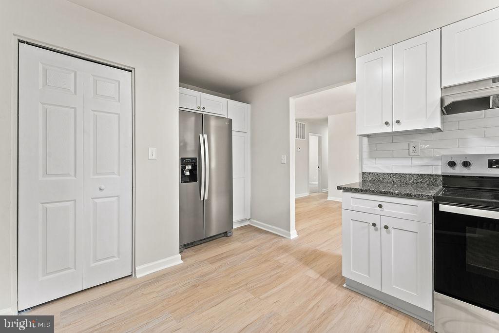 28494 Eddings Road Rhoadesville, VA 22542 - Photo 15 of 32 a kitchen with stainless steel appliances granite countertop a refrigerator and cabinets
