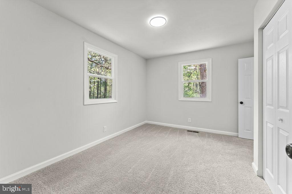 28494 Eddings Road Rhoadesville, VA 22542 - Photo 21 of 32 an empty room with windows