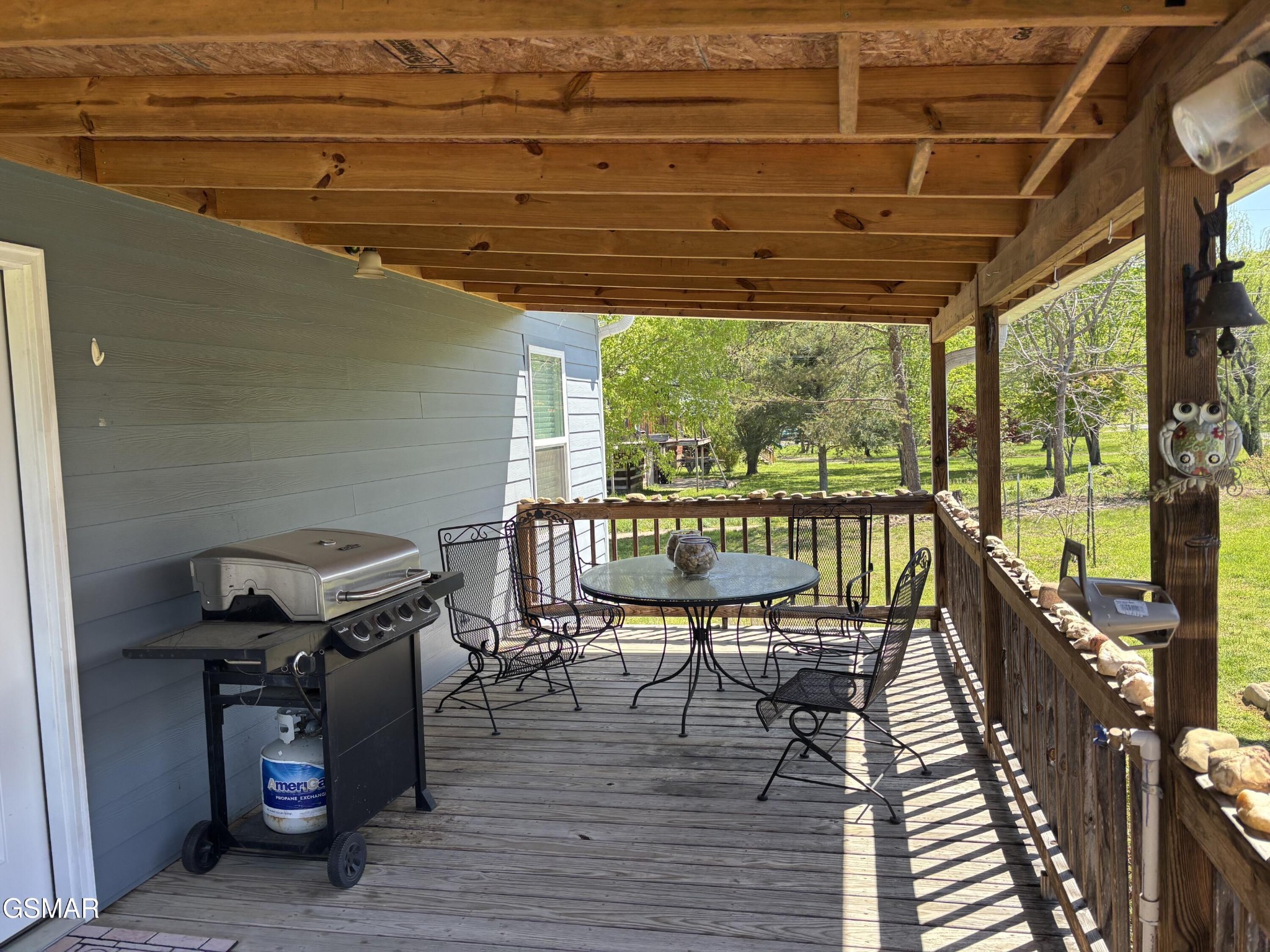 147 Padgett Mill Road Cosby, TN 37722 - Photo 23 of 36 a view of a balcony with chairs and wooden floor