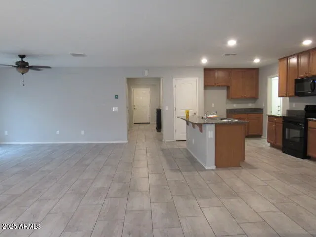 a view of a house with a yard and palm trees