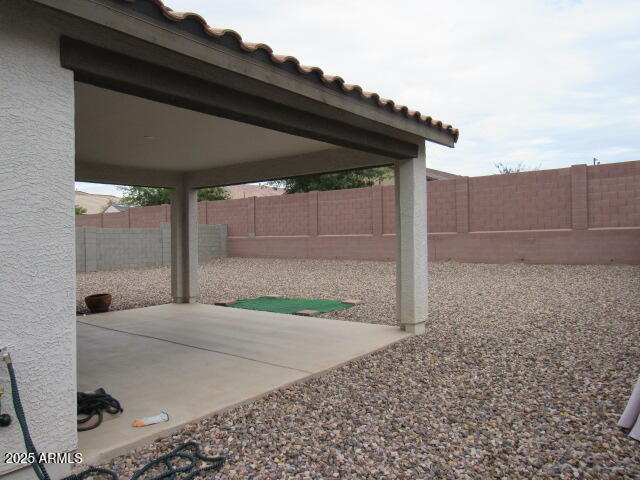 17164 West Straight Arrow Lane Surprise, AZ 85387 - Photo 18 of 39 a backyard of a house with lots of green space