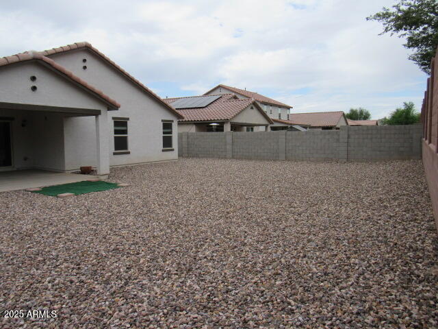 17164 West Straight Arrow Lane Surprise, AZ 85387 - Photo 19 of 39 a front view of a house with a yard and garage